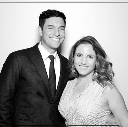 Tom and his wife are posing for a click